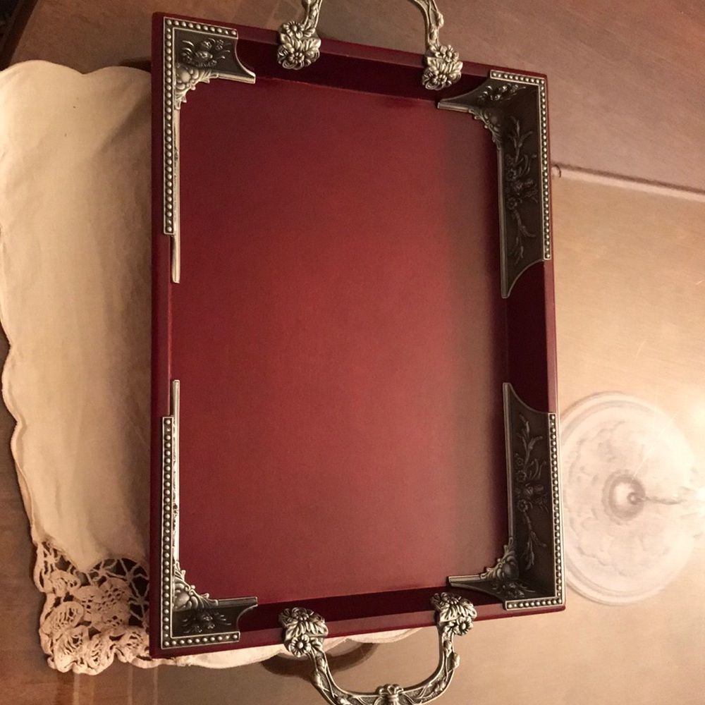 An 11 by 15 wood tray with pewter handles